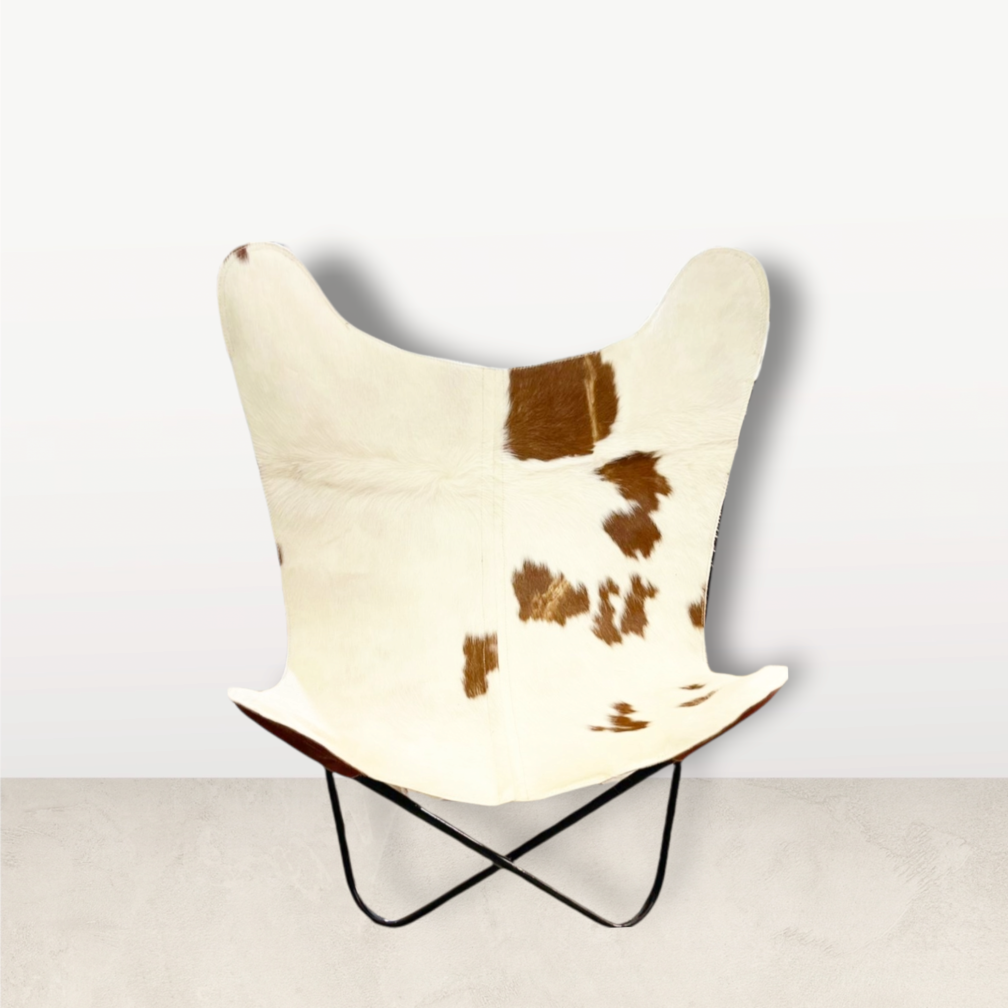 Chaise papillon Cuir de vache unique